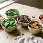 CortiSync ingredients shown as seven botanical ingredients in small bowls on a wooden table